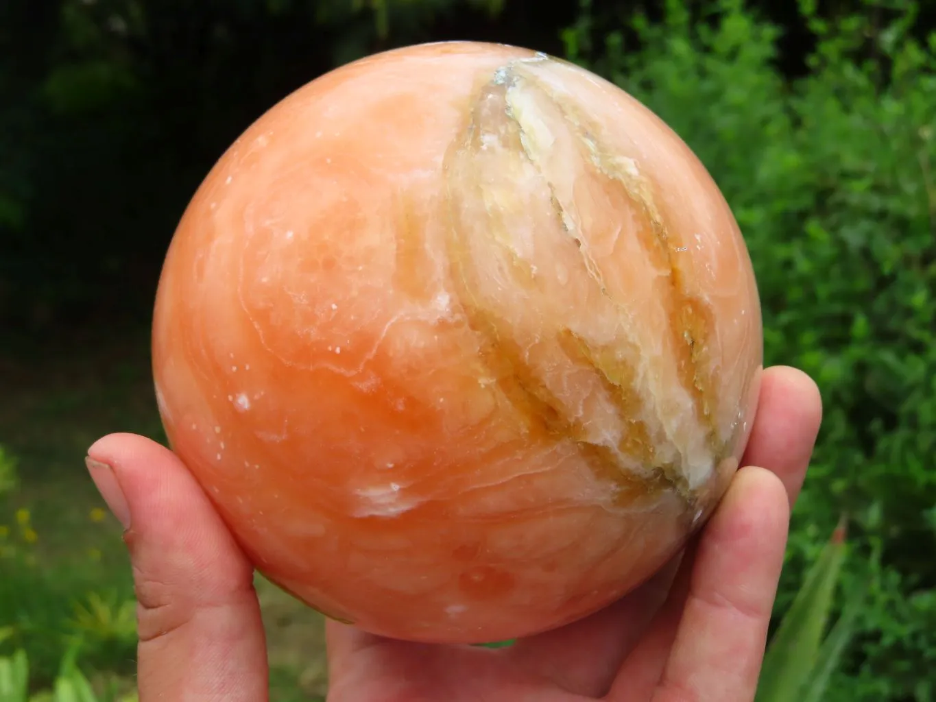 Polished Orange Calcite Sphere x 1 From Maevantanana, Madagascar